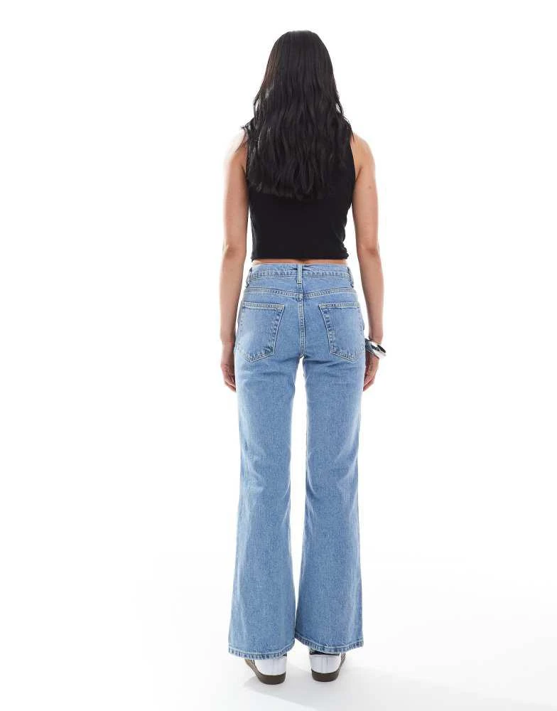 ASOS ASOS DESIGN cropped kick flare jean in mid blue 2