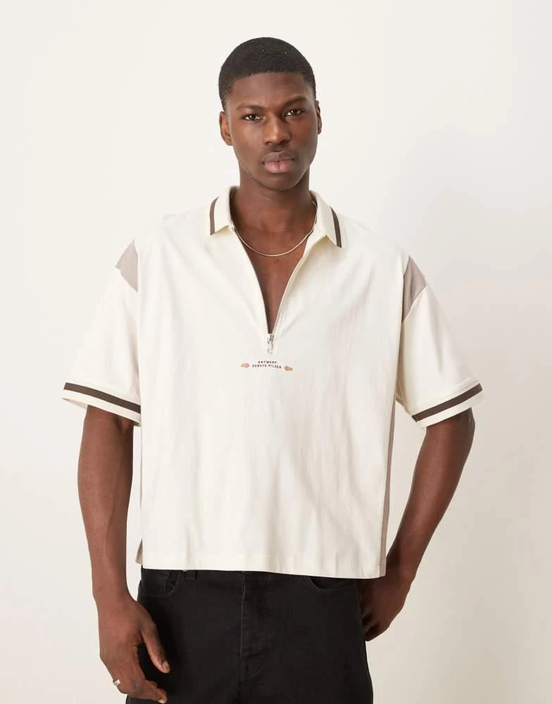 ASOS ASOS DESIGN boxy oversized zipped polo with cut and sew panelling and text graphic in cream 2