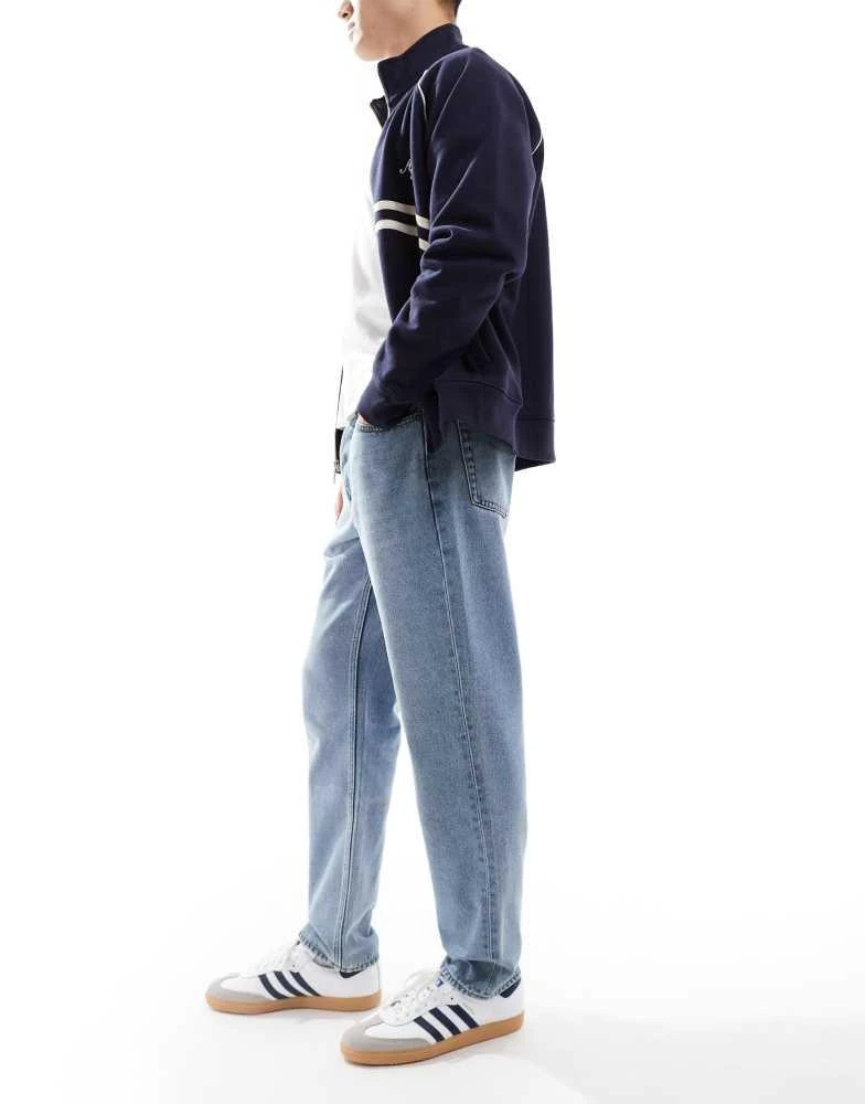 Only
Sons ONLY
SONS loose tapered jeans in light blue wash 2