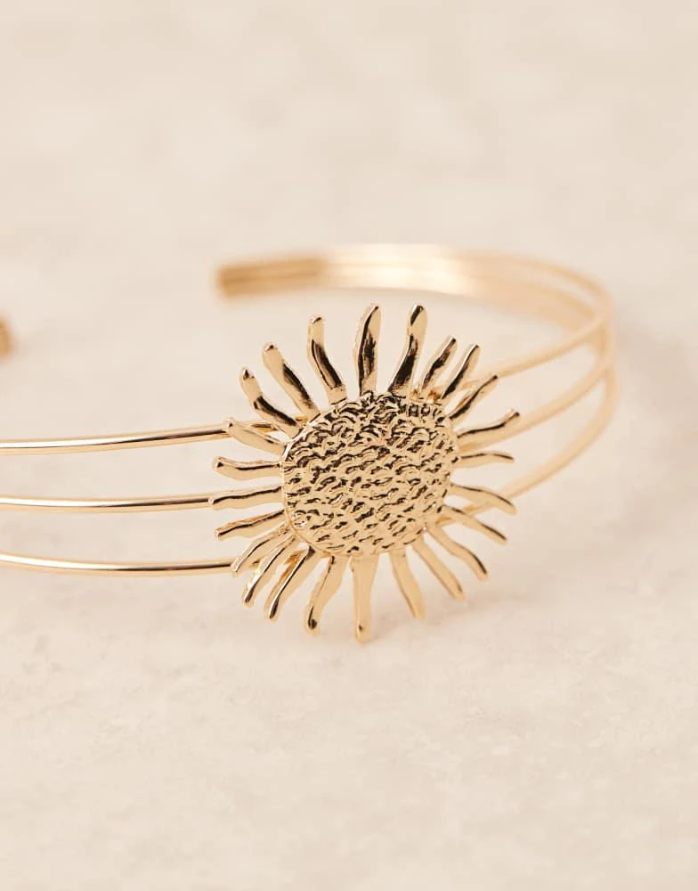 ASOS ASOS DESIGN Curve arm cuff with enamelled sun design in gold tone 2
