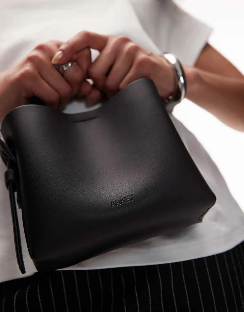 ARKET ARKET small leather cross body tote bag with side buckle detail in black 2
