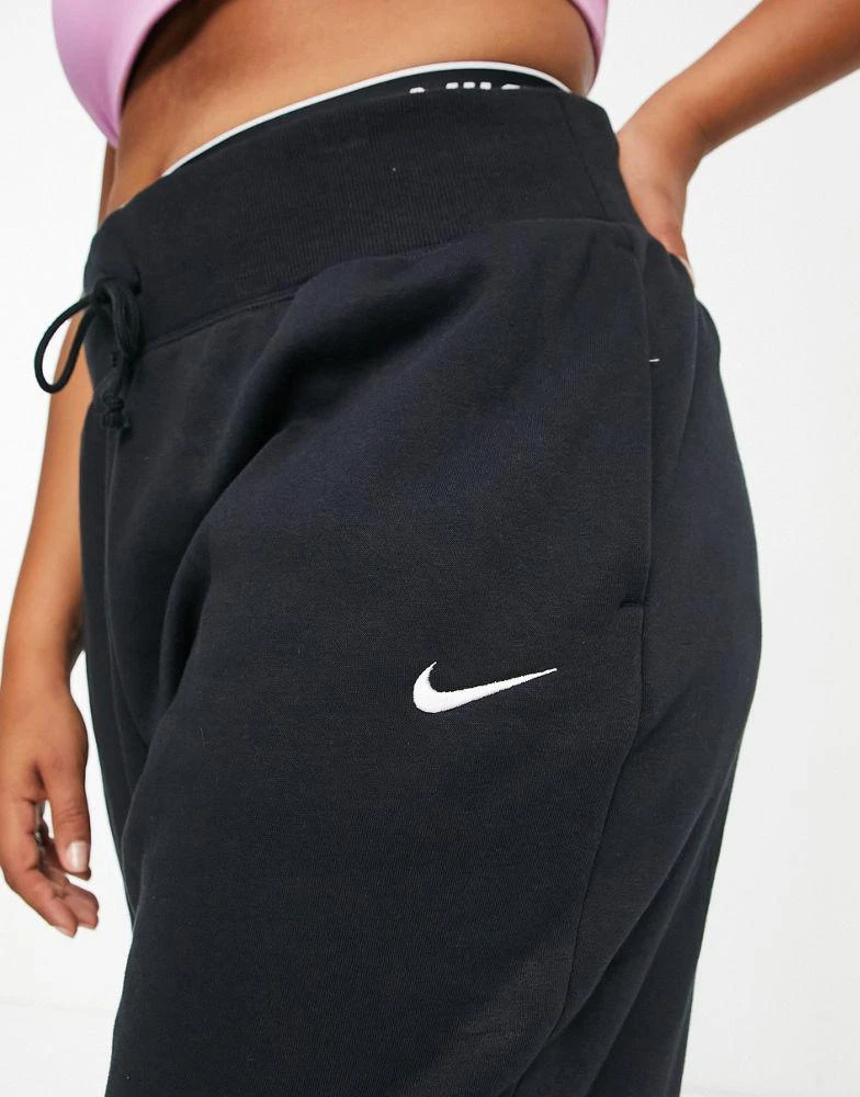 NIKE Nike Plus mini swoosh oversized high rise joggers in black and sail 3