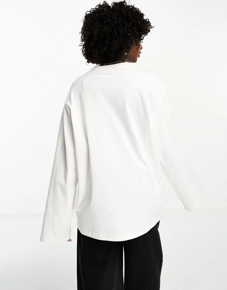 Weekday Weekday oversized long sleeve top in white 2