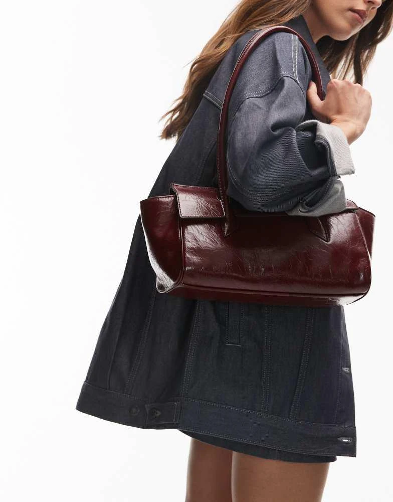 Shop Topshop Sunny shoulder bag with asymmetric flap in burgundy
