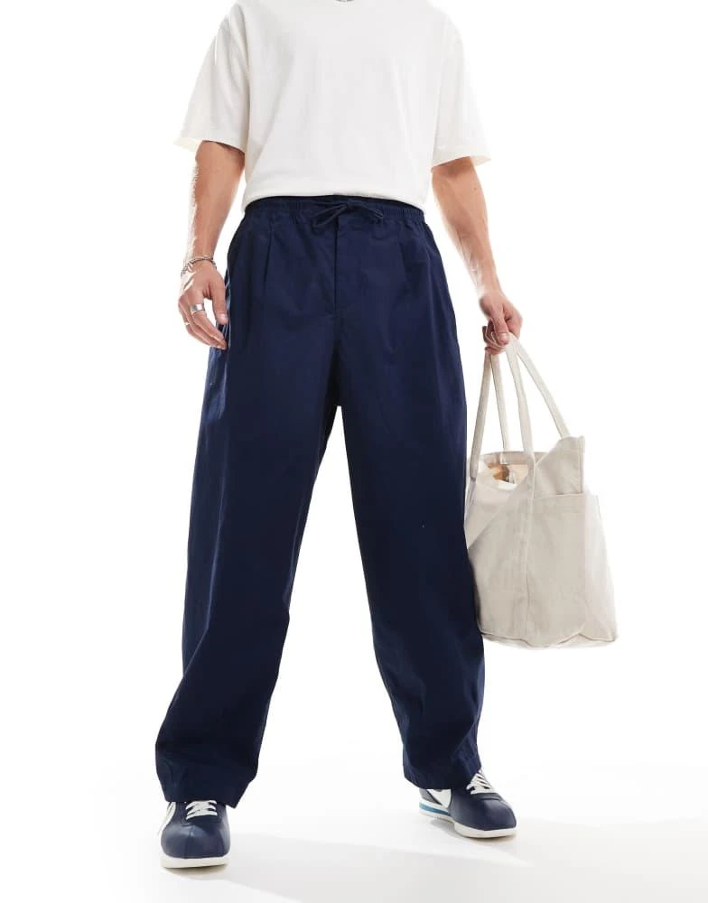 NIKE Nike Club woven balloon oversized trousers in navy 1