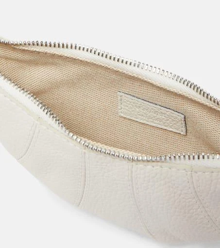 Shop Croissant leather coin purse with strap on Sale at