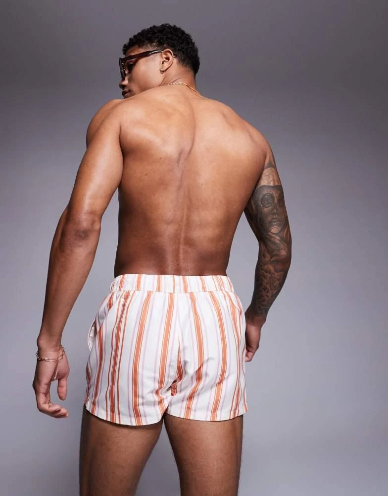 ASOS ASOS DESIGN swim short in super short length in white and orange stripe 3