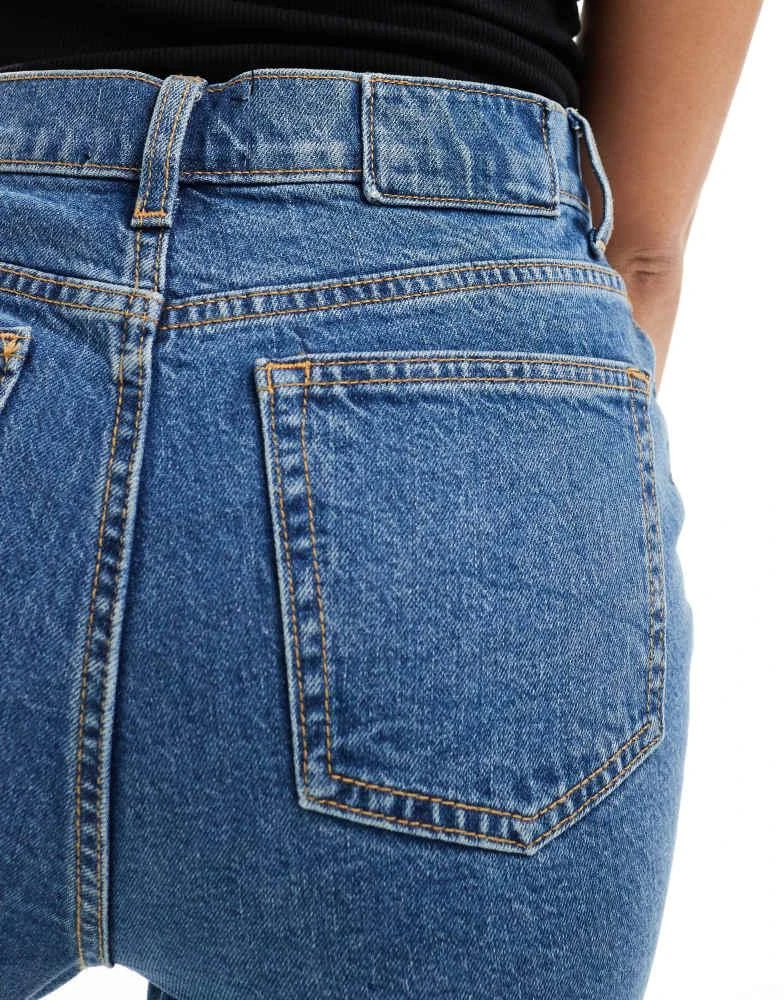 ASOS ASOS DESIGN mid rise flare jeans in mid blue 3