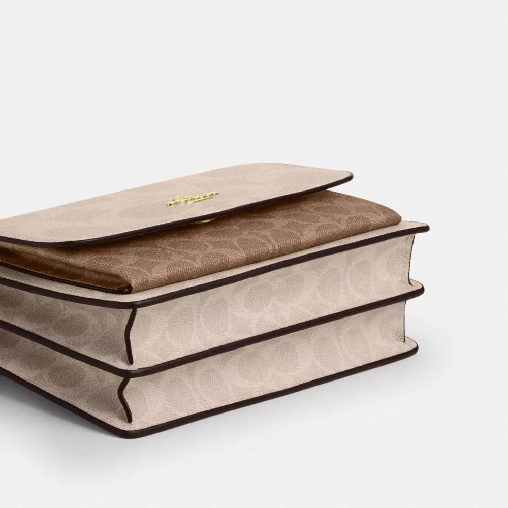 Shop Klare Crossbody Bag In Blocked Signature Canvas on Sale