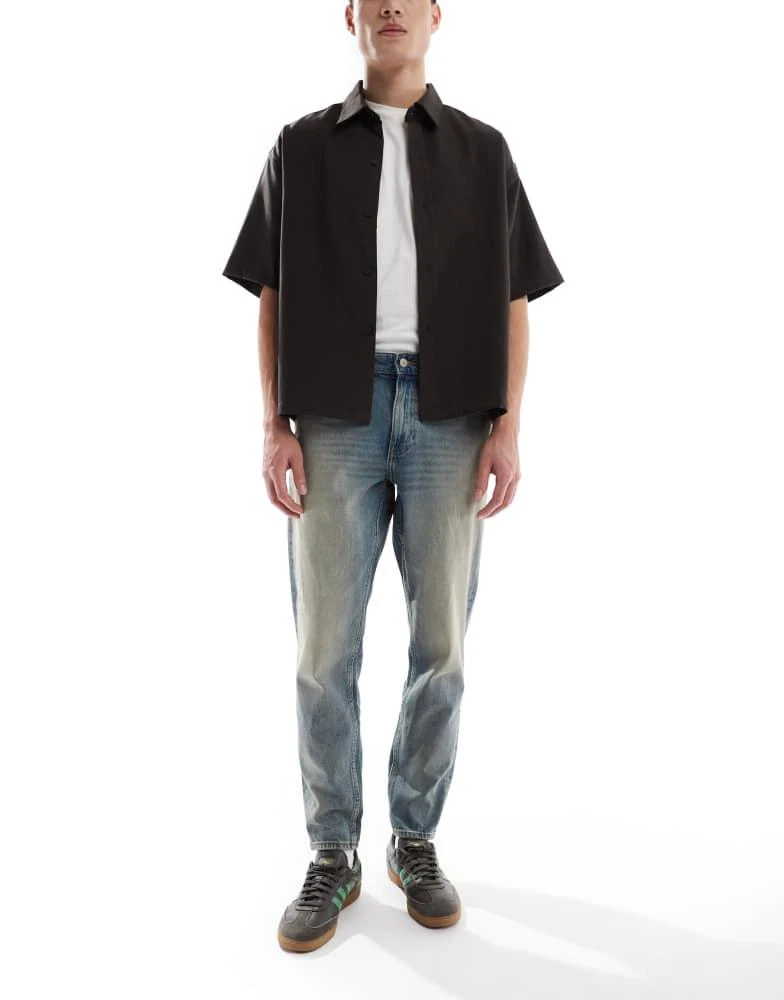 ASOS ASOS DESIGN tapered jeans with tint in light wash blue 1