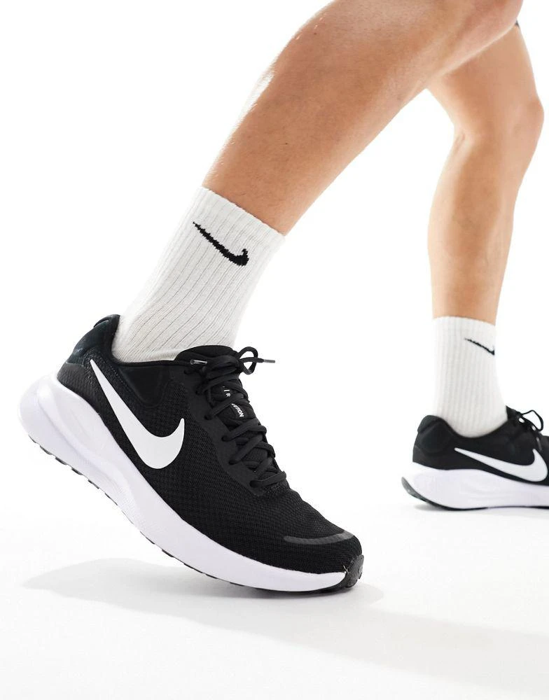Shop Nike Running Revolution trainers in black and white on Sale