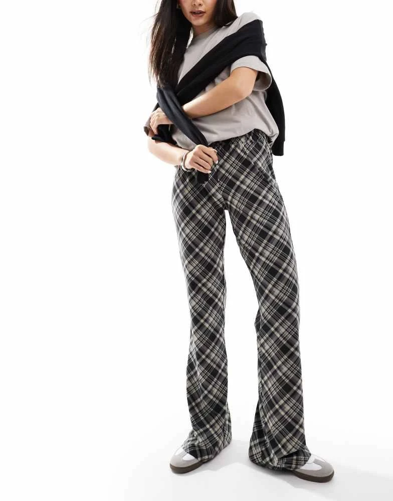 Noisy May Noisy May flared trousers in black check 1