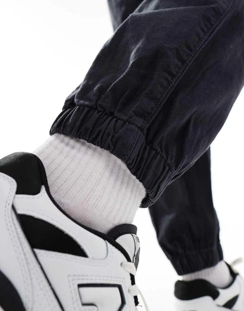 ASOS ASOS DESIGN tapered pull on linen trouser in washed navy 3