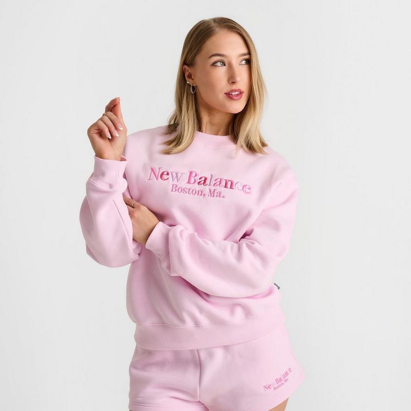 Shop Women's New Balance Logo Crewneck Sweatshirt on Sale at