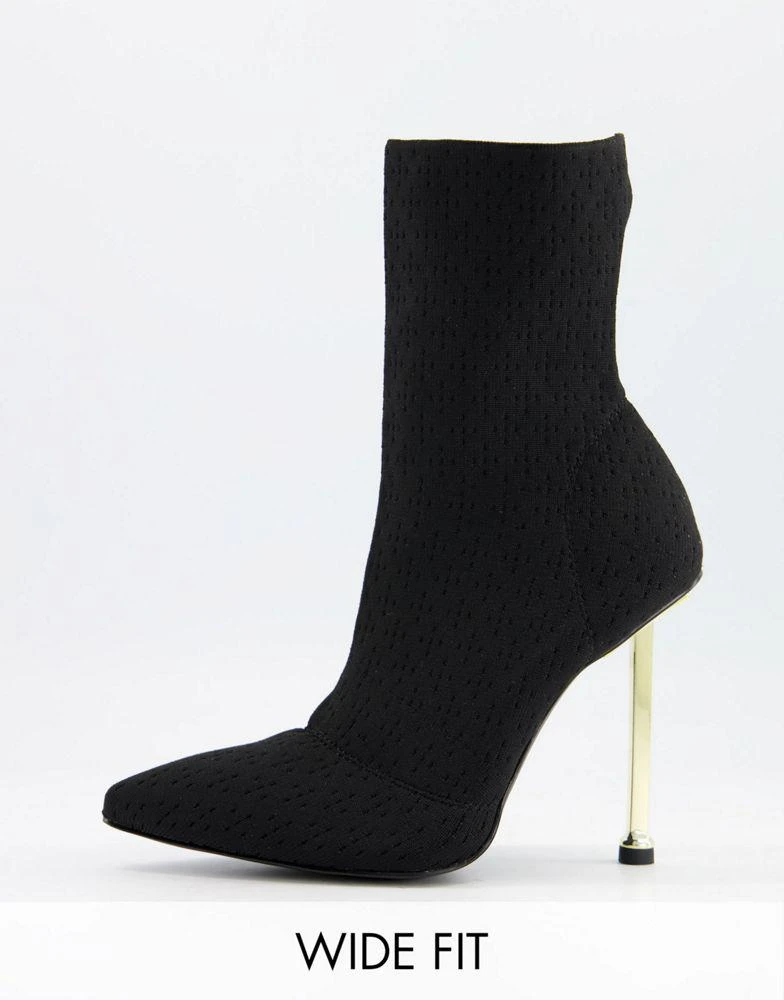 Simmi Wide Fit Simmi London Wide Fit Shae sock boots with gold heel in black from ASOS