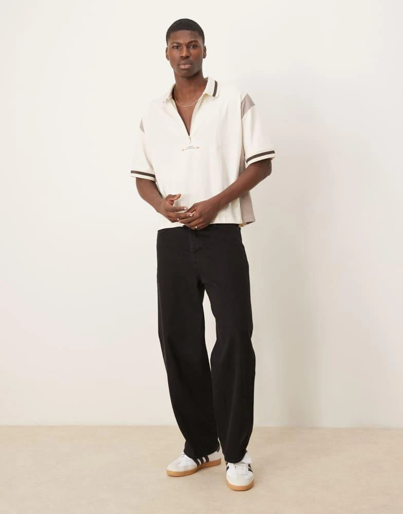 ASOS ASOS DESIGN boxy oversized zipped polo with cut and sew panelling and text graphic in cream 4