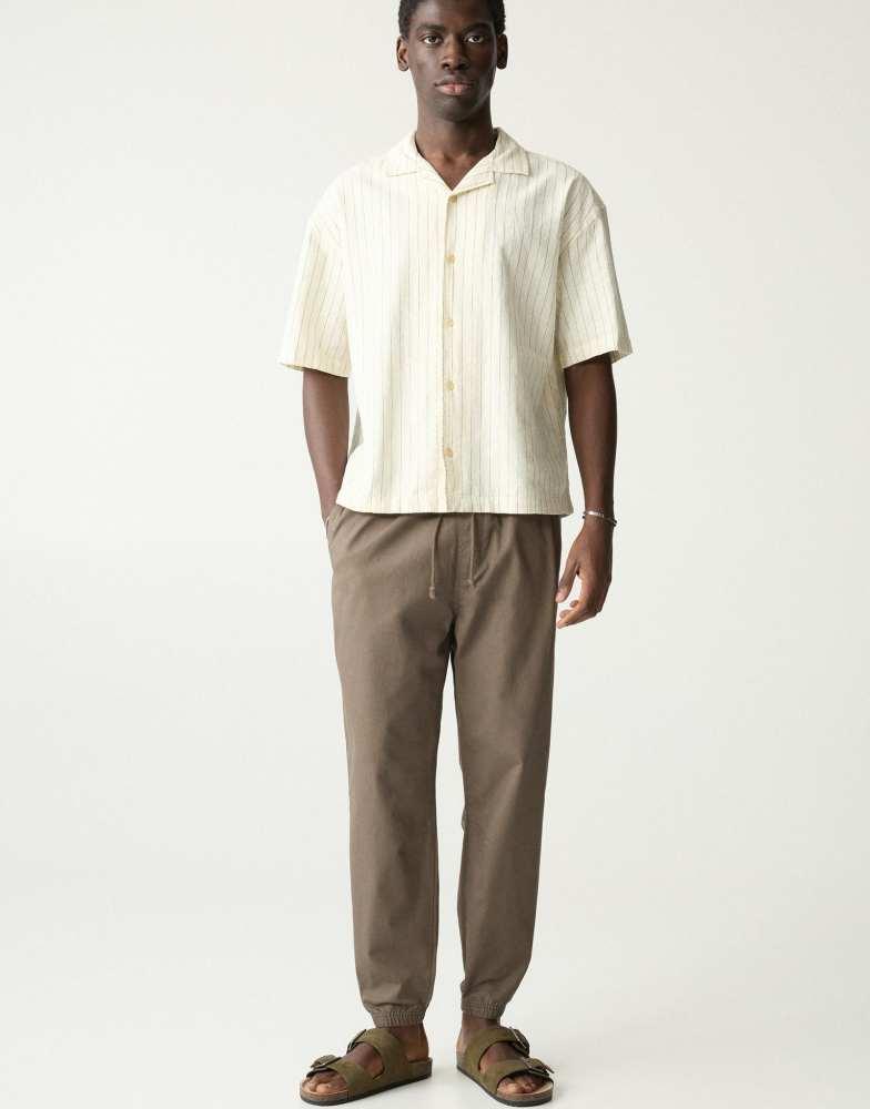 Pull&Bear Pull&Bear textured weave jogger trousers in khaki