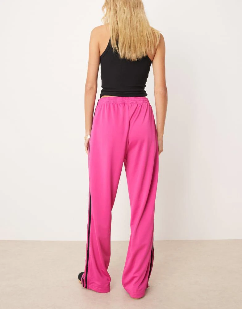 Adidas adidas Originals Adicolor classic firebird loose track pants in fuchsia and black 2