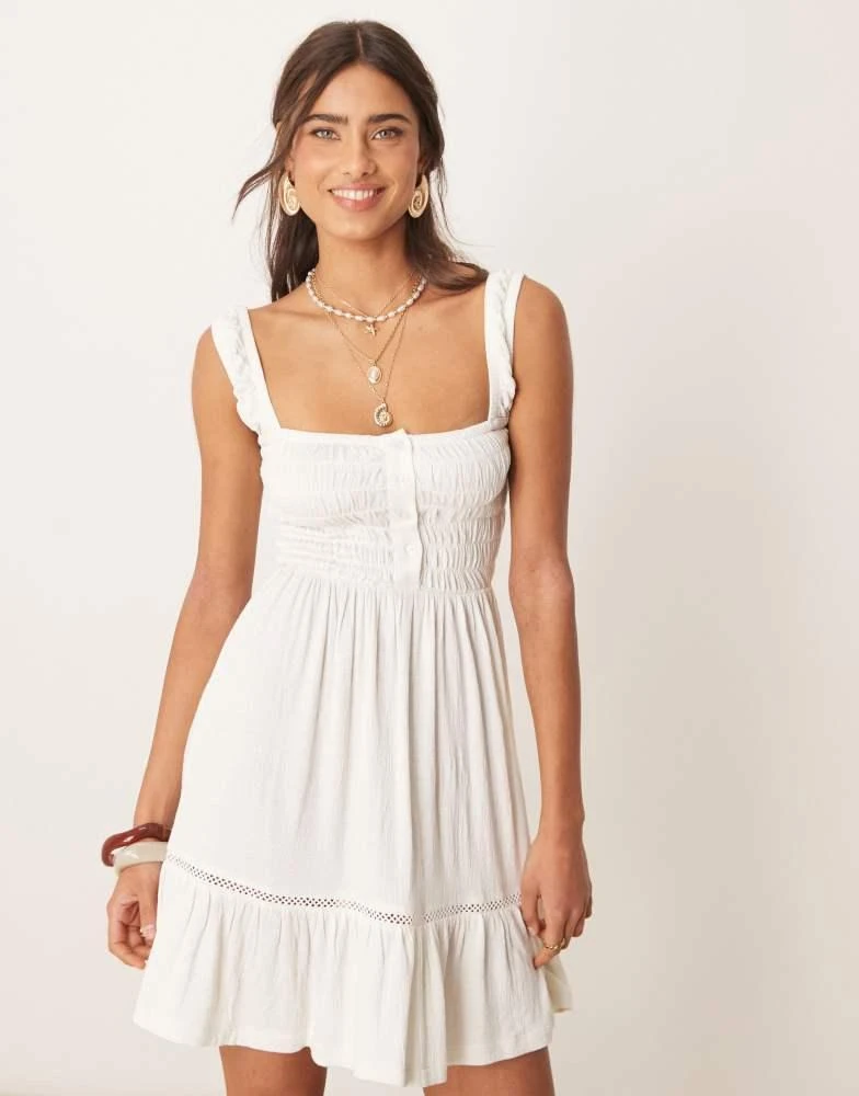 asos design tiered mini dress ASOS Design Petite Crinkle Scoop Tiered Mini Dress in cream-White