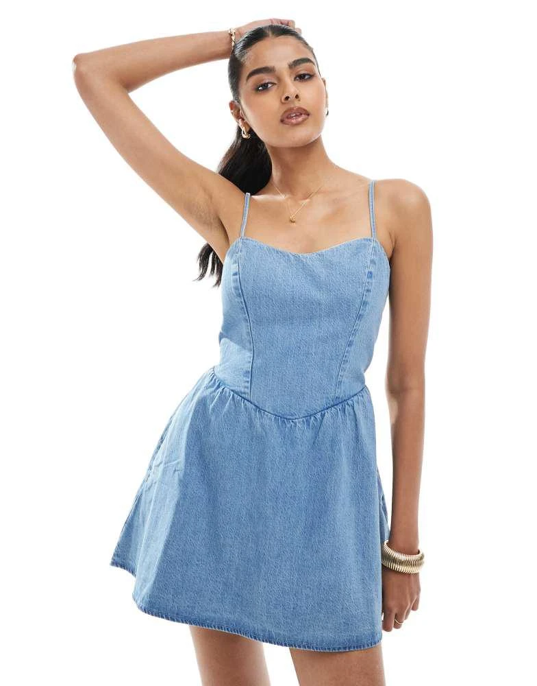 HOLLISTER Hollister drop waist sleeveless tie back mini dress in light wash denim 1