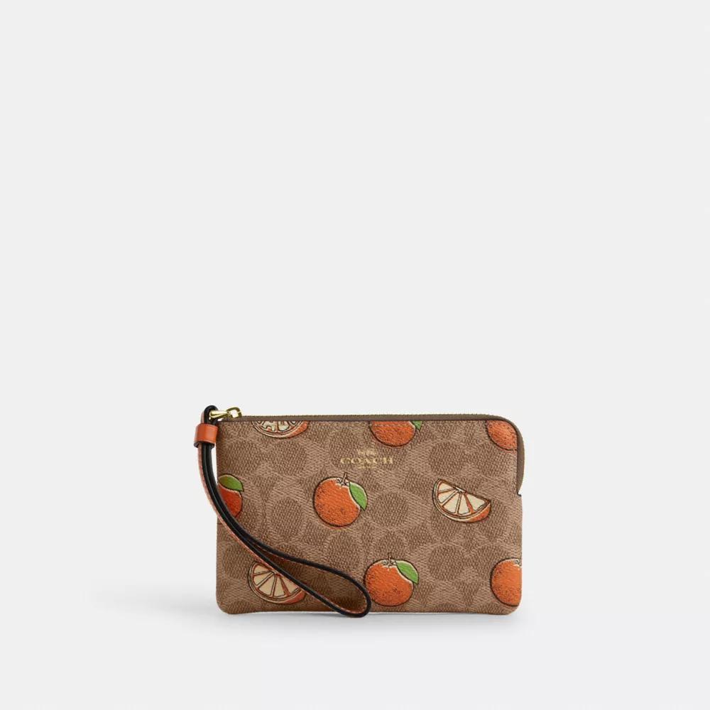 Coach Corner Zip Wristlet In Signature Canvas With Orange Print