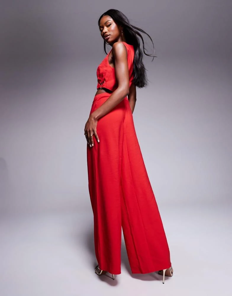 ASOS ASOS DESIGN wrap front cut out jumpsuit with buckle detail in red 4