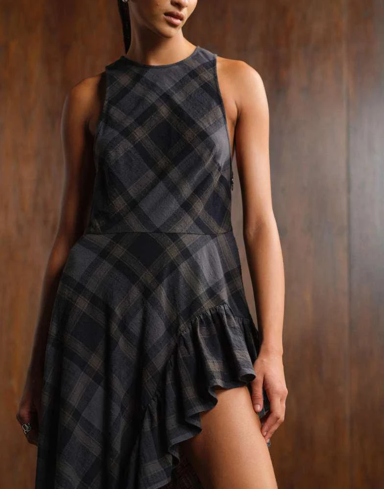 Shop Monki sleeveless maxi dress with asymmetric ruffle hem in