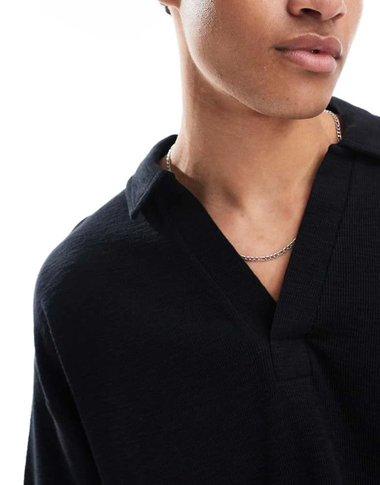 Shop ASOS DESIGN oversized boxy revere collar polo shirt in black