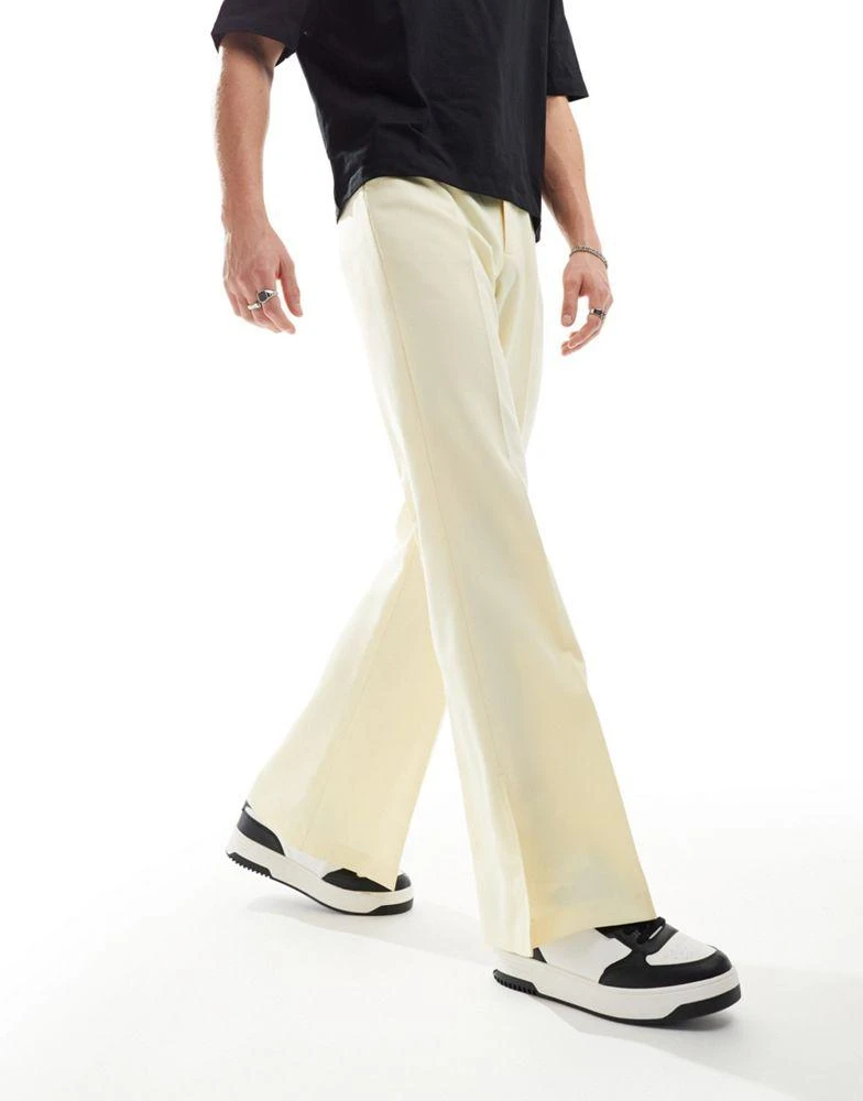 ASOS ASOS DESIGN smart vintage flare trousers with side split in yellow 1