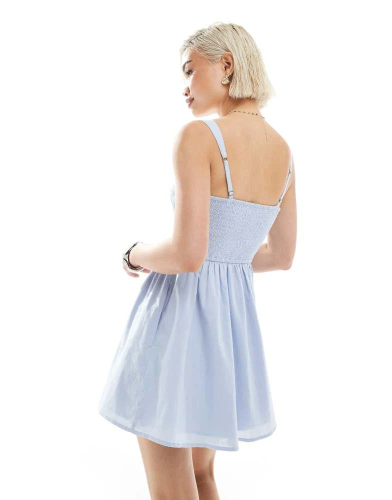 Shop Hollister milkmaid drop waist button detail sleeveless mini dress in  dusty blue on Sale at BeyondStyle – Get 32% Off Hollister milkmaid drop  waist button detail sleeveless mini dress in dusty