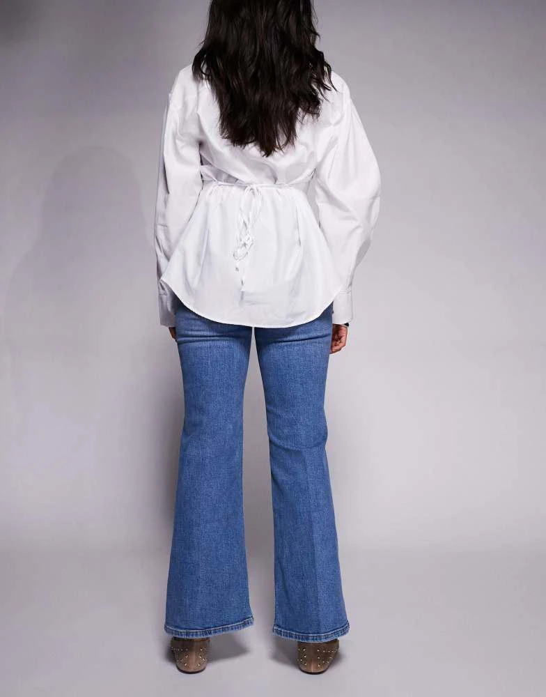 River Island River Island petite high rise pocket detail flare jeans in light denim 3