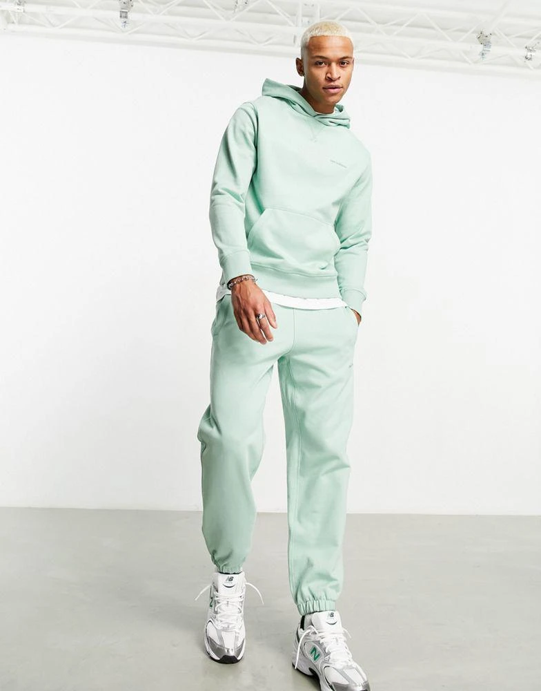 New Balance New Balance Athletics State Sweatpant in light green 1