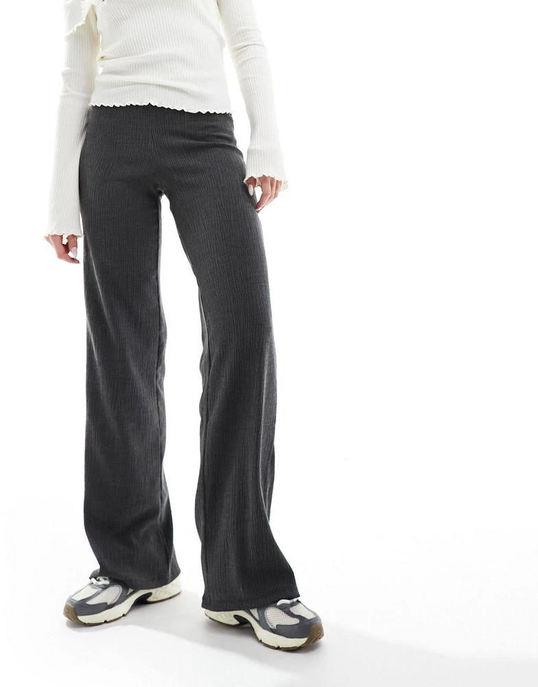 Bershka Bershka crinkle flared trousers in charcoal 1
