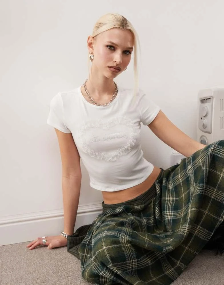 Monki Monki shrunken fit top with frill heart graphic in white 2