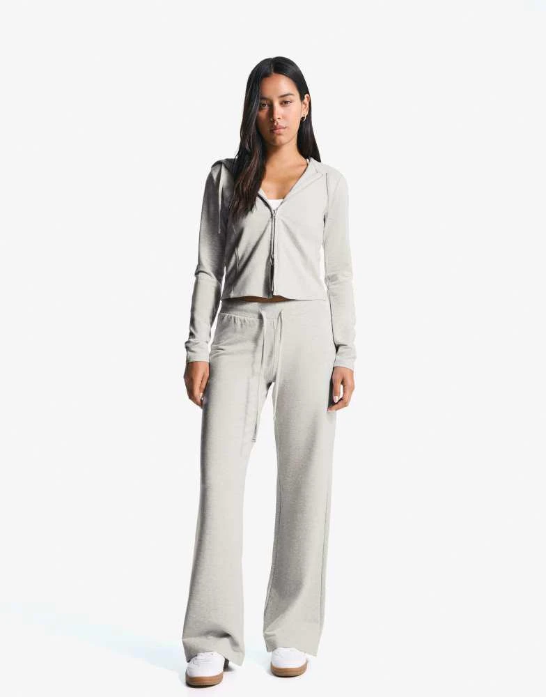 Bershka Bershka Plush jersey trousers in light grey 1