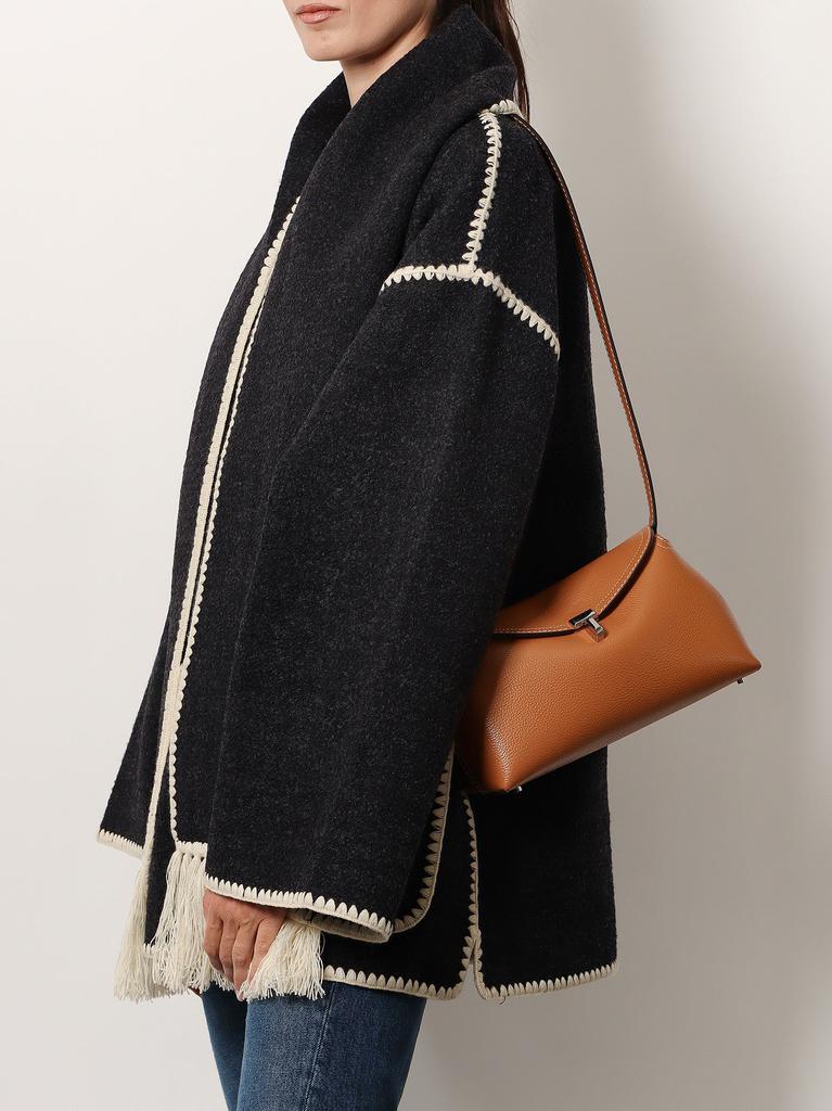 Totême T-Lock leather clutch with contrasting stitching