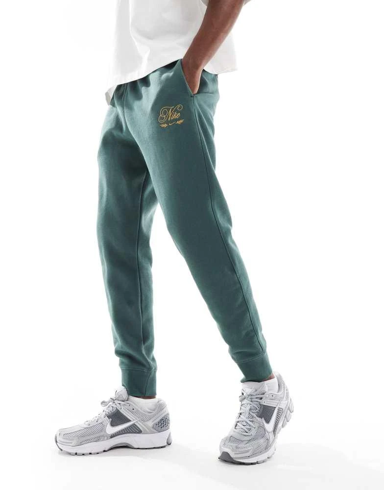 NIKE Nike Club festive joggers in dark green 1