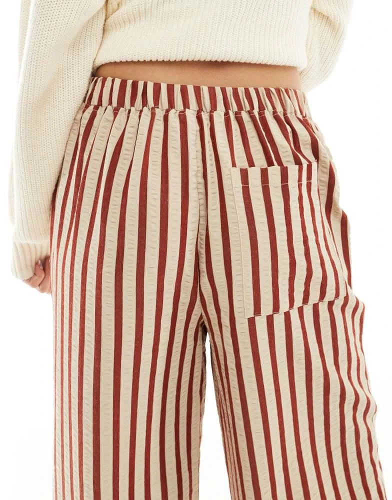ASOS ASOS DESIGN straight leg seersucker trousers in rust stripe 5