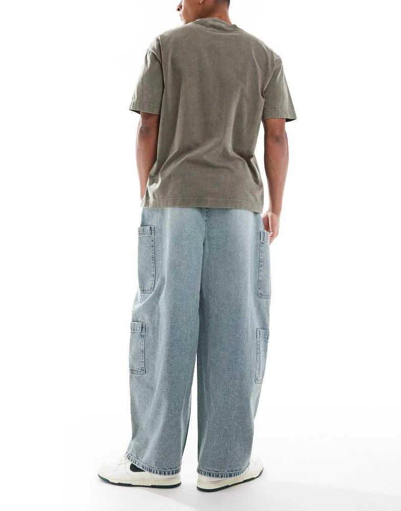ASOS ASOS DESIGN oversized baggy jeans in bleach wash with tint and cargo pockets 2