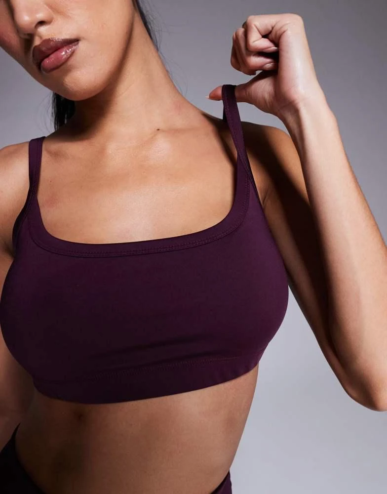 ASOS 4505 active medium support sports bra with removable padding in burgundy 4
