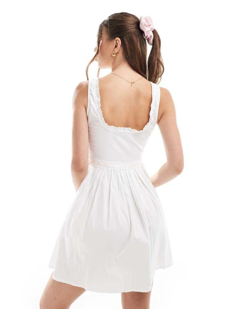 ASOS ASOS DESIGN pintuck mini prairie dress with ribbon trim in white 4