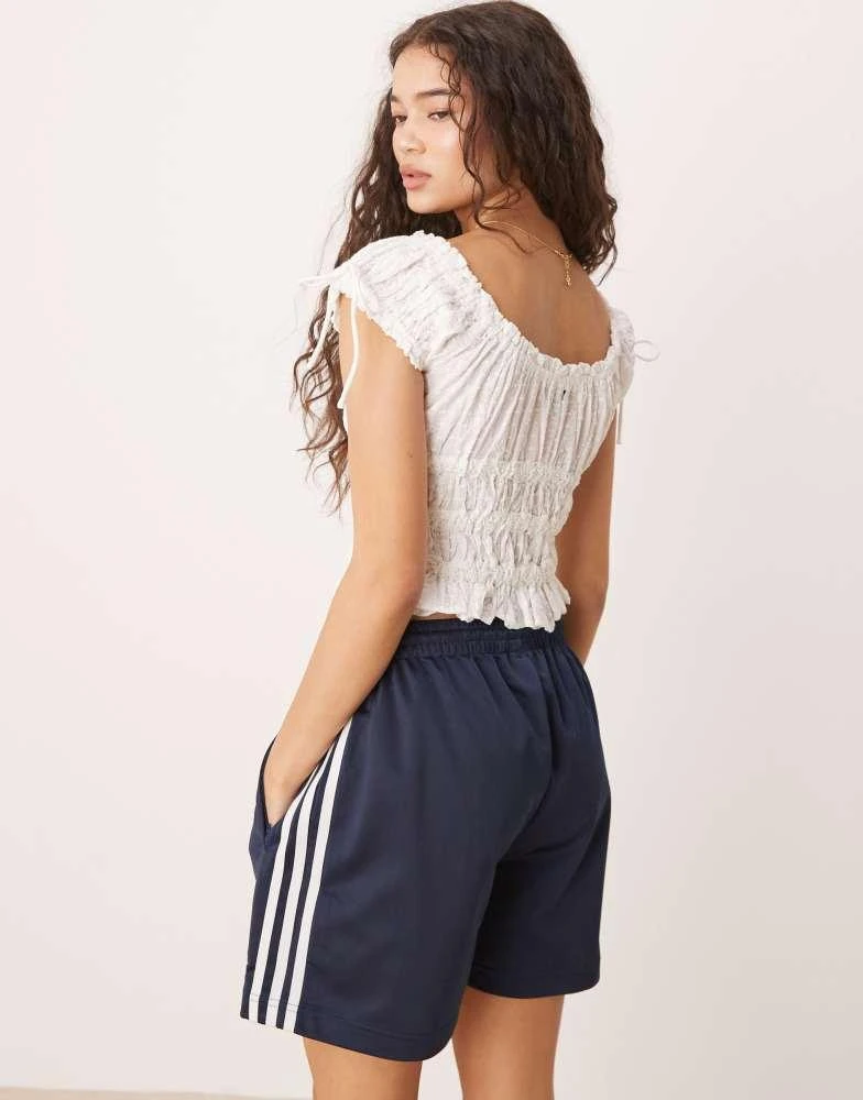 Adidas adidas Originals Firebird shorts in navy 4