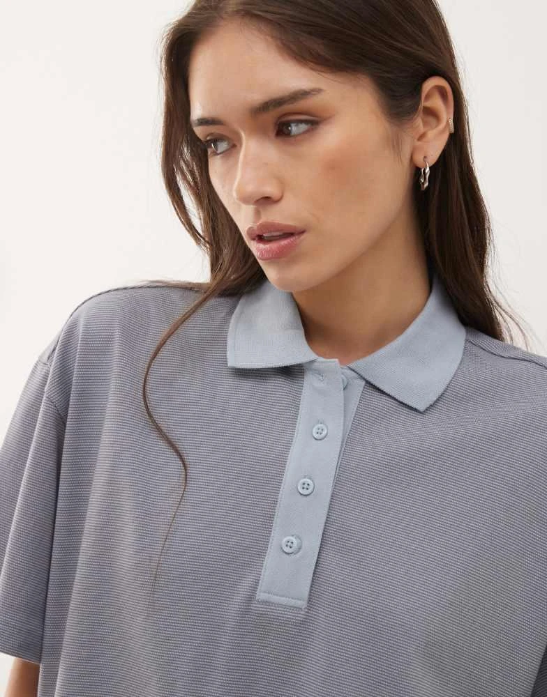 Monki Monki boxy fit short sleeve polo shirt in blue stripe 3