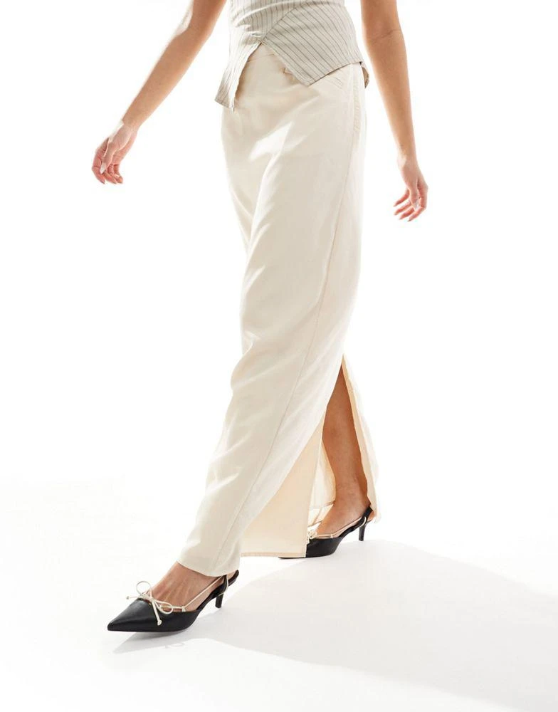 NA-KD NA-KD x Laura Jane Stone maxi skirt with front pockets and back split detail in beige 1