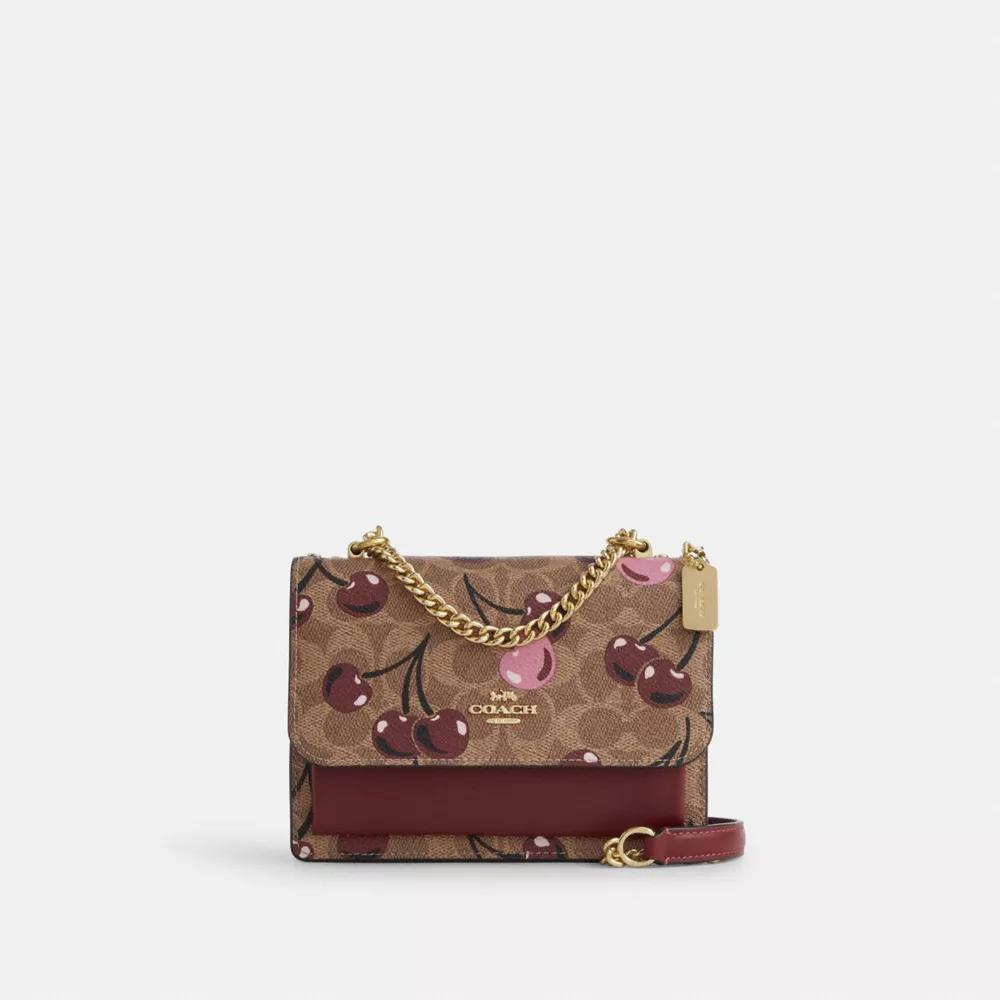 undefined Mini Klare Crossbody Bag In Signature Canvas With Cherry Print