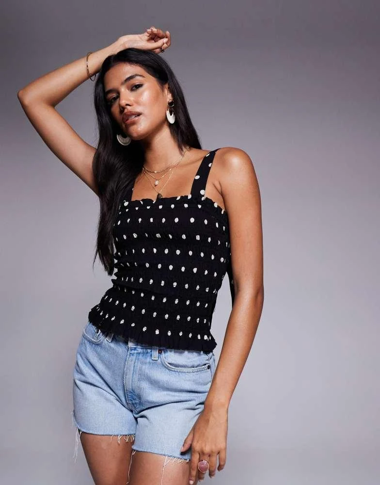 Shop River Island polka dot shirred top in black on Sale at
