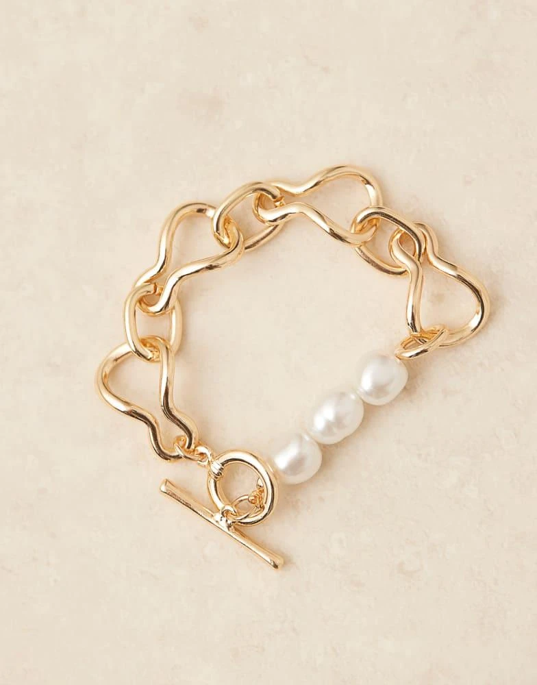 ASOS ASOS DESIGN chain bracelet with t-bar and faux pearl details in gold tone 2