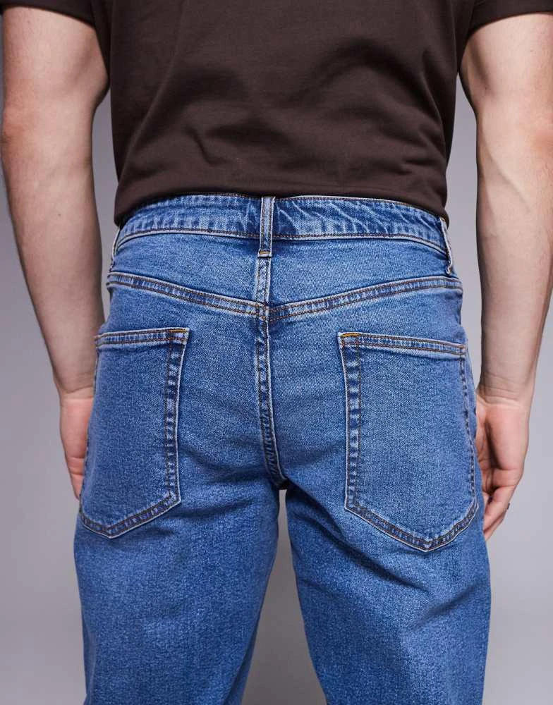 ASOS ASOS DESIGN slim fit jean in mid wash blue 4