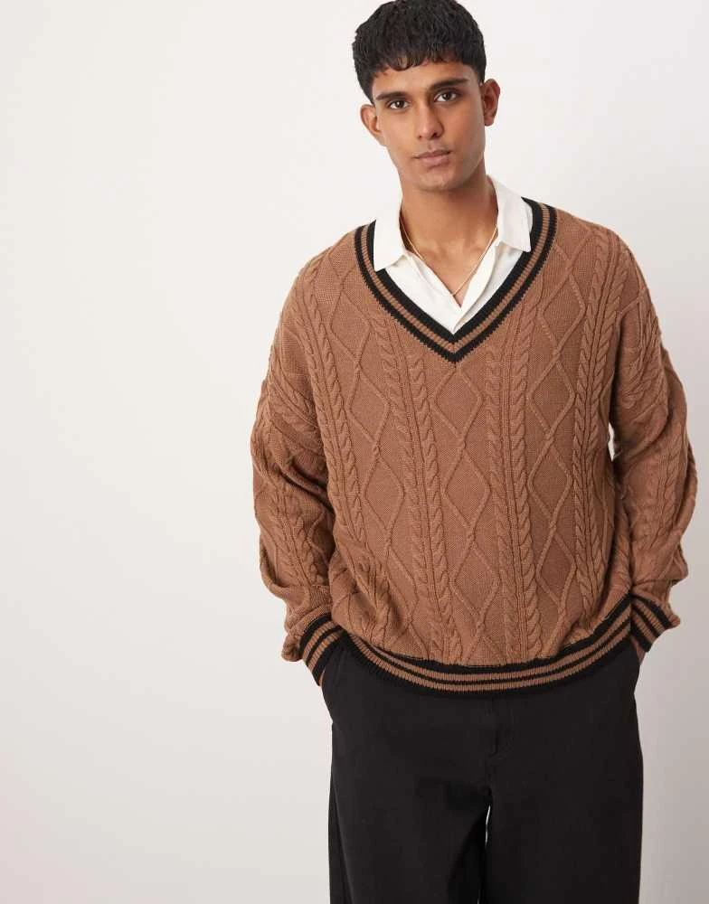 ASOS ASOS DESIGN oversized boxy fit cable knit cricket jumper in brown with black tipping 1