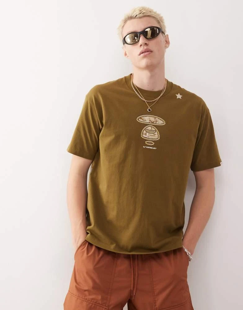 AAPE Aape by A Bathing Ape boxy fit t-shirt in khaki green with multi placement western print 1